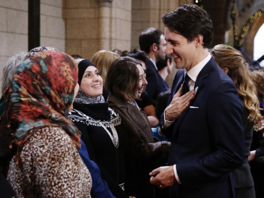 Slide 37: image of Justin Trudeau greeting a woman wearing a hijab by holding his hand to his chest, not trying to grab her in a handshake.