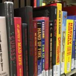 books on a shelf, from the humor section. Prominent title is KRAZY